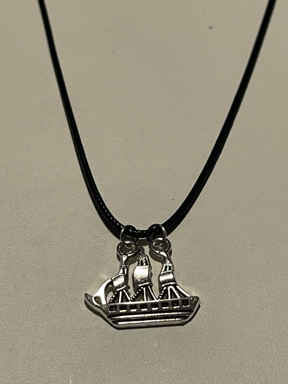 Silver Ship Pendant Necklace on Black Cord
